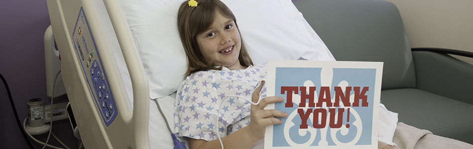 Smiling Patient with Thank You Sign